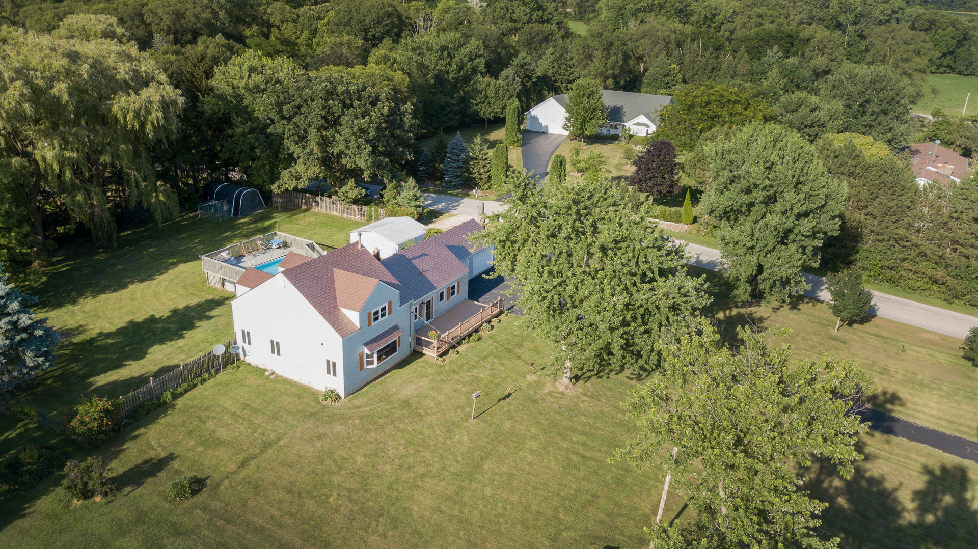 20806 Lembcke Road Harvard, IL 60033 - Photo 42 of 44 a view of a house with a yard and a swimming pool