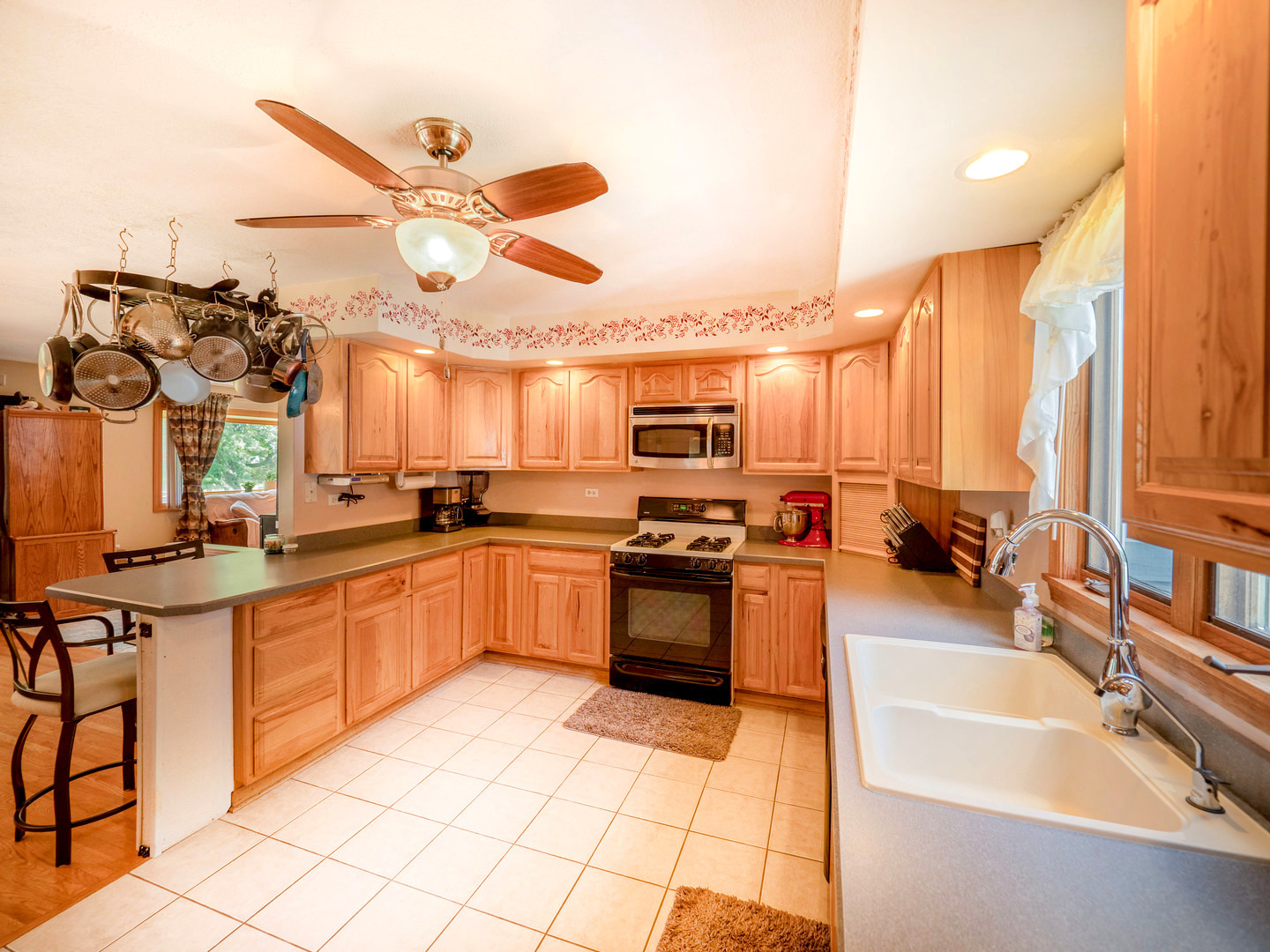 20806 Lembcke Road Harvard, IL 60033 - Photo 6 of 44 a kitchen with stainless steel appliances granite countertop a sink and stove