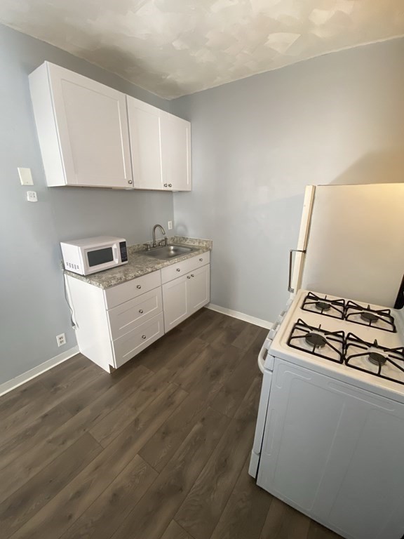 502 4th Street, Unit 2E Fall River, MA 02721 - Photo 2 of 5 a room with storage and utility