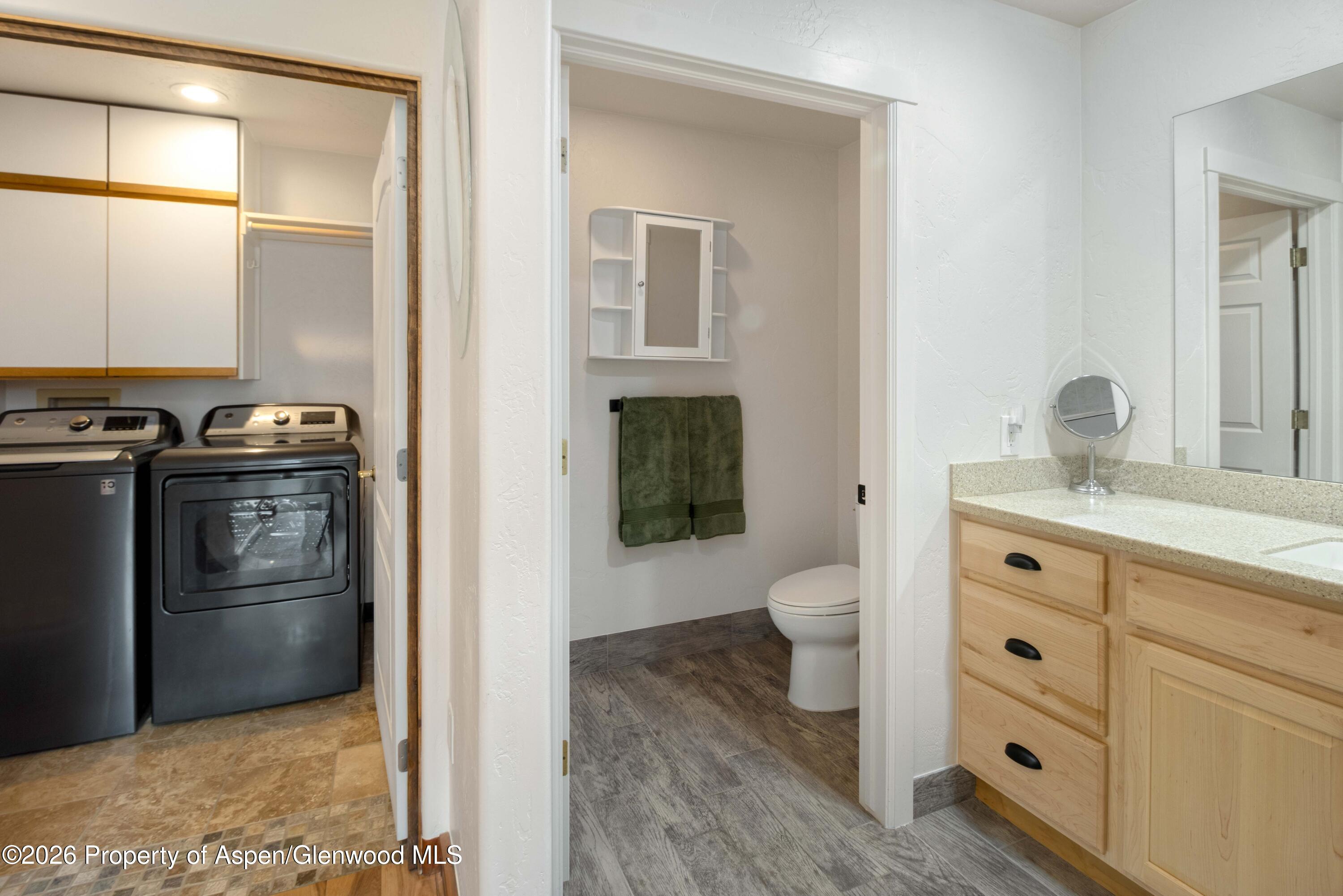 25 West Ridge Court Parachute, CO 81635 - Photo 13 of 21 a bathroom with a granite countertop sink toilet and shower