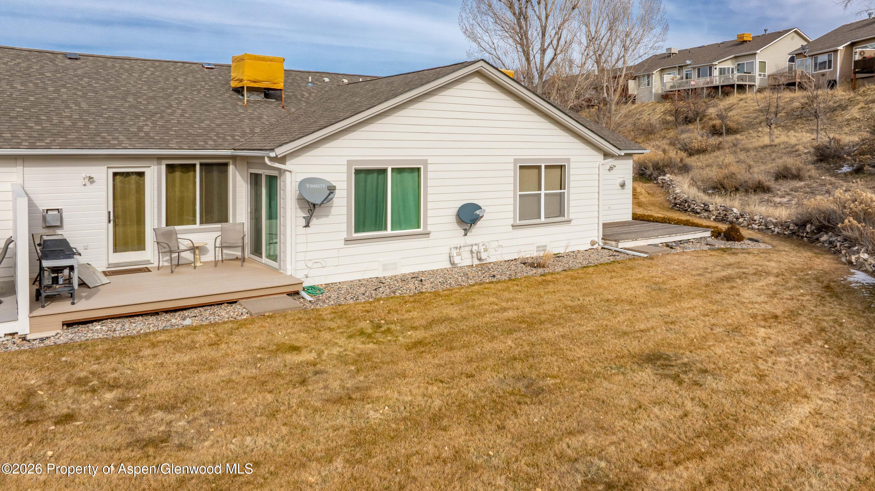 25 West Ridge Court Parachute, CO 81635 - Photo 15 of 21 a view of house with backyard and seating space