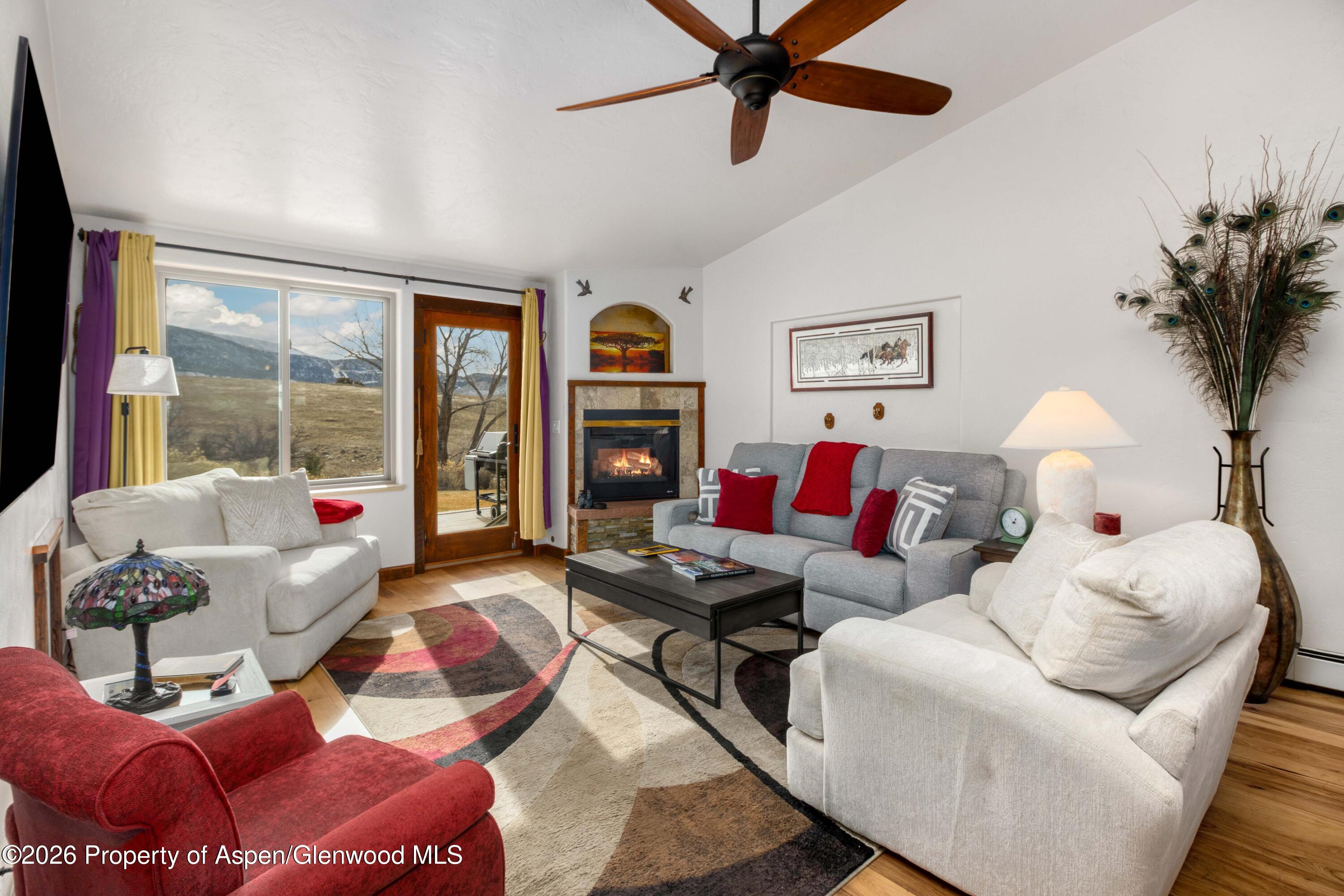 25 West Ridge Court Parachute, CO 81635 - Photo 4 of 21 a living room with furniture and a large window