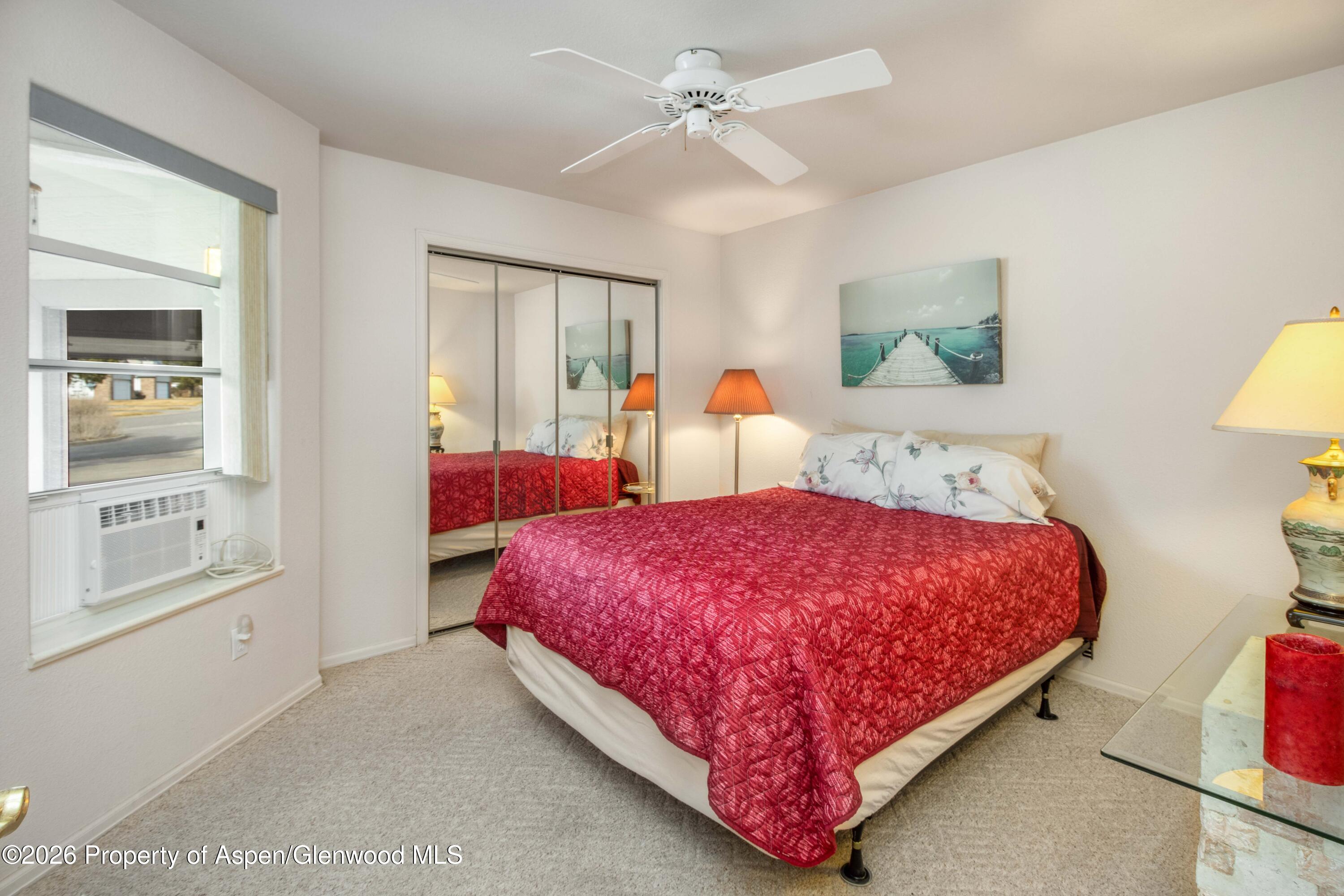 25 West Ridge Court Parachute, CO 81635 - Photo 8 of 21 a bedroom with a bed and a painting on the wall