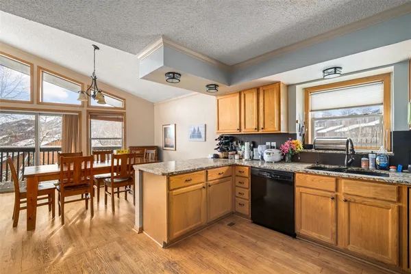 a kitchen with lots of counter top space and dining table