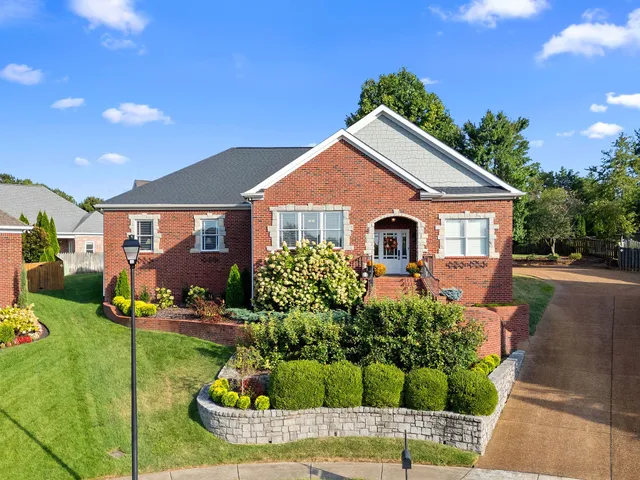 a front view of a house with garden
