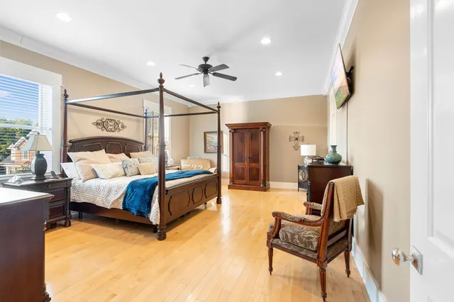 a bedroom with furniture and a window