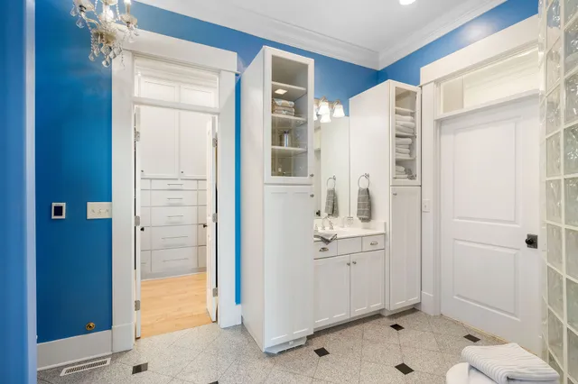 a bathroom with a sink and mirror