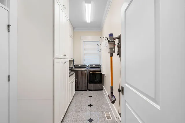a kitchen with a refrigerator and a stove