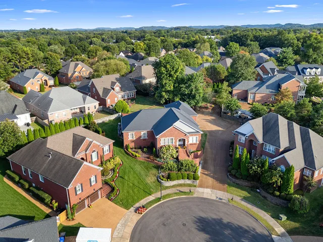an aerial view of a house with a garden