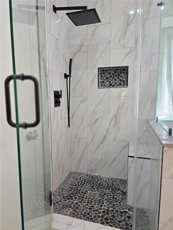 6992 Ivy Pointe Row Austell, GA 30168 - Photo 19 of 30 a bathroom with a shower