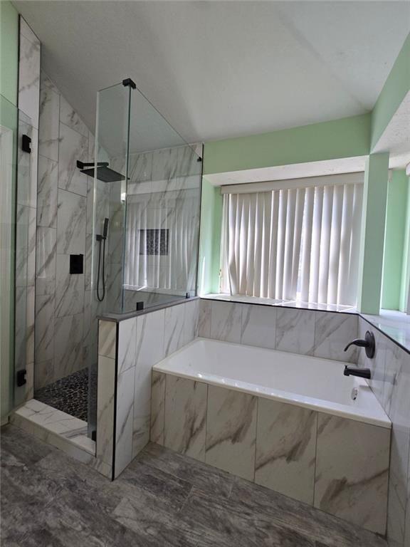 6992 Ivy Pointe Row Austell, GA 30168 - Photo 21 of 30 a bathroom with a bathtub and a shower
