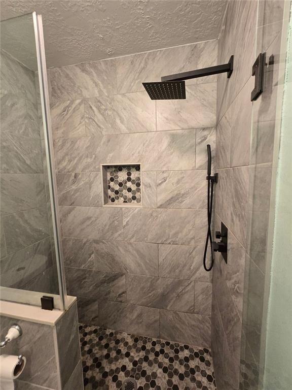 6992 Ivy Pointe Row Austell, GA 30168 - Photo 25 of 30 a bathroom with a shower