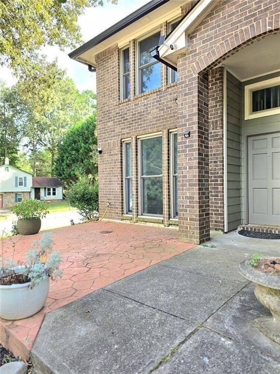 6992 Ivy Pointe Row Austell, GA 30168 - Photo 28 of 30 a backyard of a house with outdoor seating