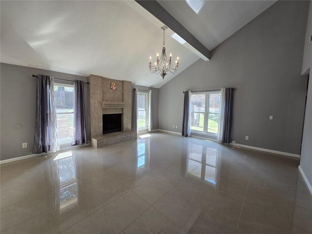 6992 Ivy Pointe Row Austell, GA 30168 - Photo 10 of 30 an empty room with windows and fireplace