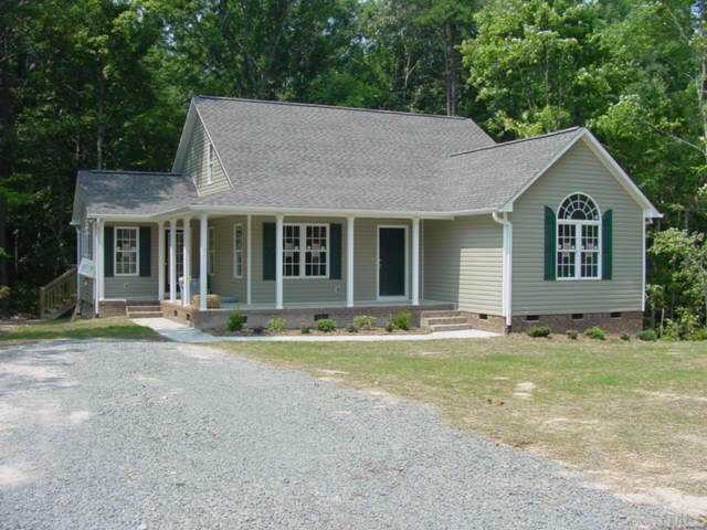 2511 Burton Road Durham, NC 27704 - Photo 1 of 1 a front view of a house with a yard