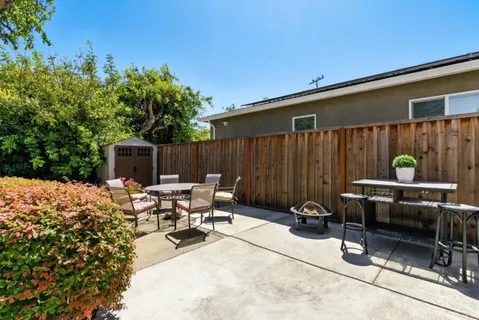 a view of backyard with furniture