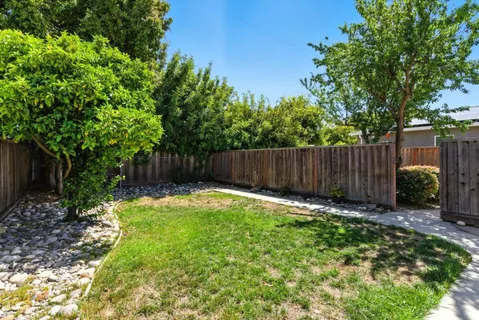 a view of outdoor space with wooden fence