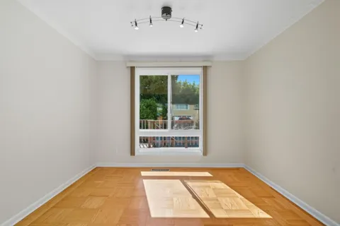 a view of an empty room and window