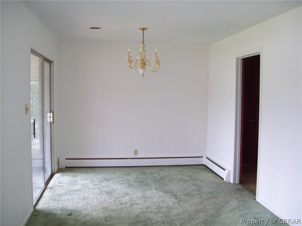 344 Ballast Point Road Hudgins, VA 23076 - Photo 5 of 12 an empty room with chandelier