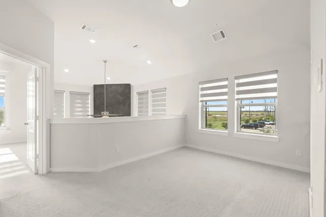 a view of a hallway with stairs