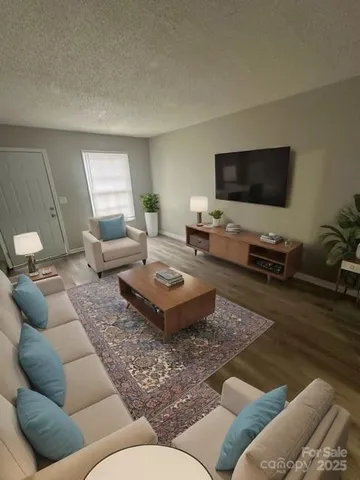a living room with furniture and a flat screen tv