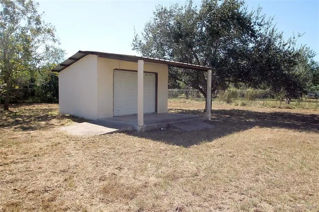 a backyard of a house with lots of green space