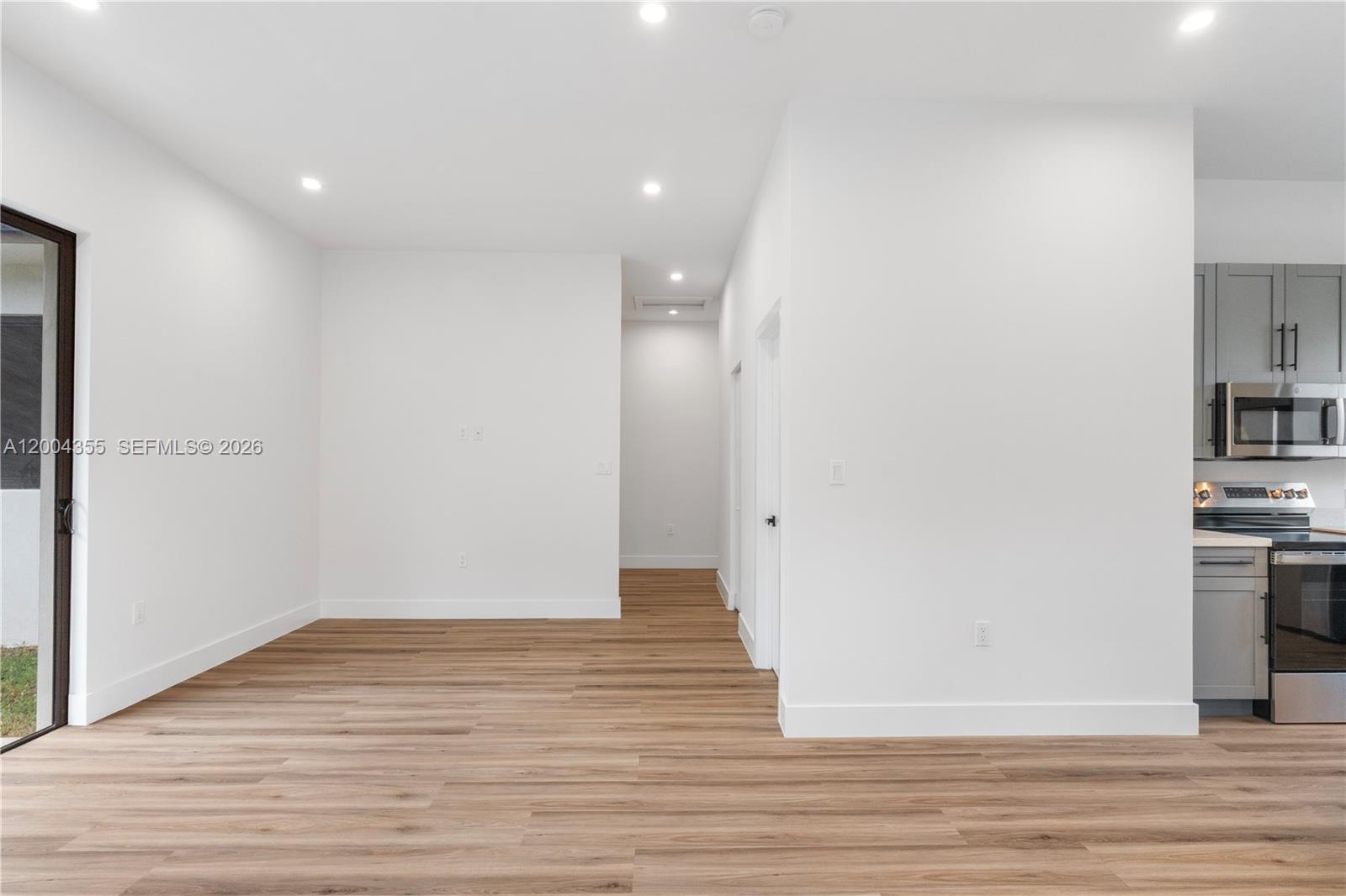 4518 Northwest 4th Street Miami, FL 33126 - Photo 17 of 23 a view of a kitchen cabinets and wooden floor