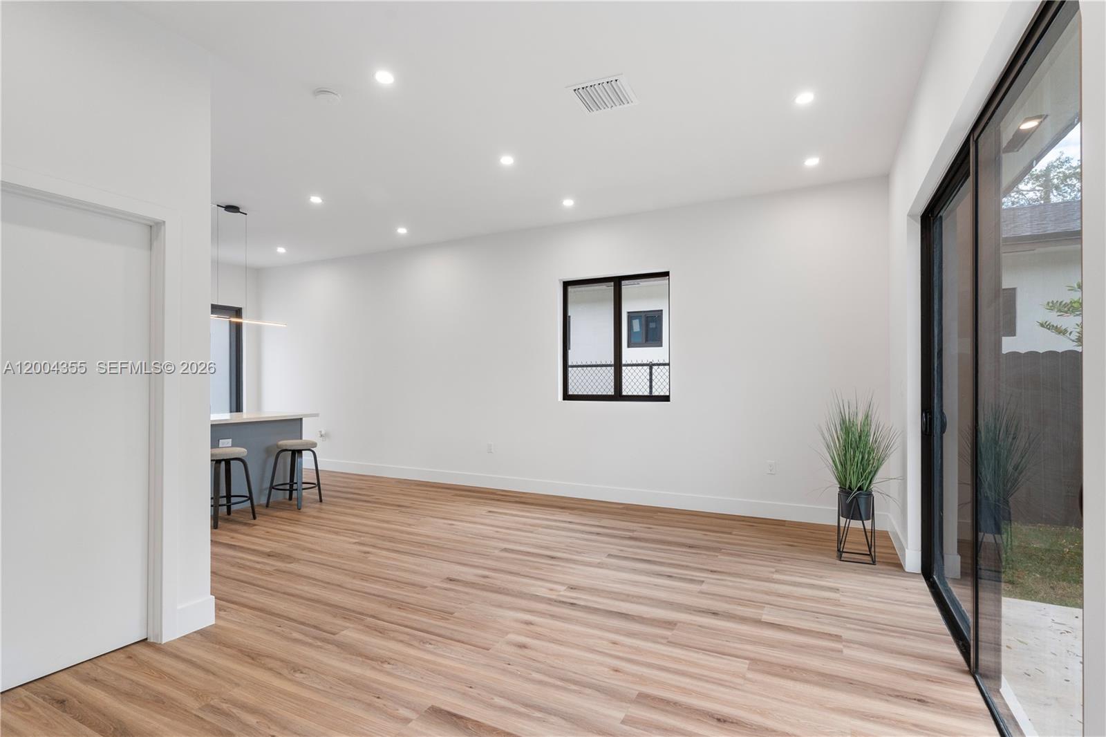 4518 Northwest 4th Street Miami, FL 33126 - Photo 18 of 23 a view of a livingroom with a furniture and wooden floor