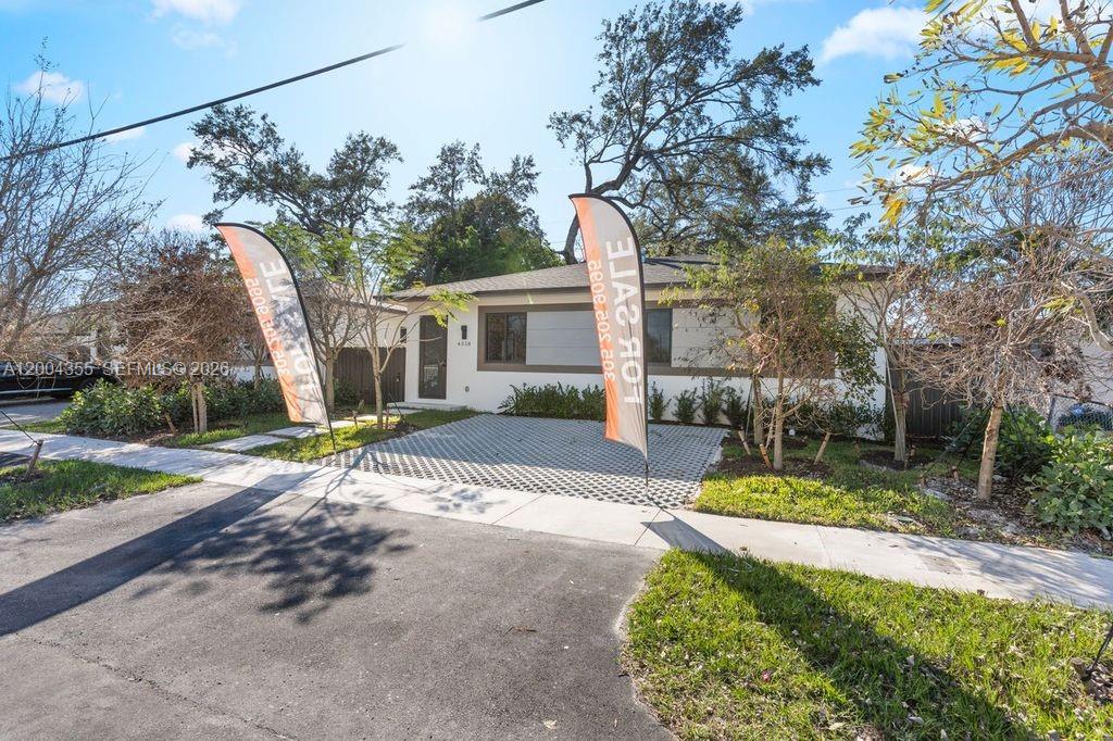 4518 Northwest 4th Street Miami, FL 33126 - Photo 22 of 23 a view of a house with backyard and tree s