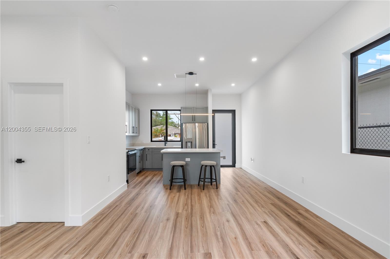 4518 Northwest 4th Street Miami, FL 33126 - Photo 6 of 23 a view of a dining room with furniture window and wooden floor