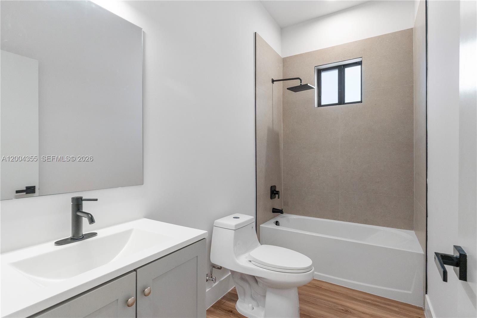 4518 Northwest 4th Street Miami, FL 33126 - Photo 8 of 23 a bathroom with a sink toilet and bathtub