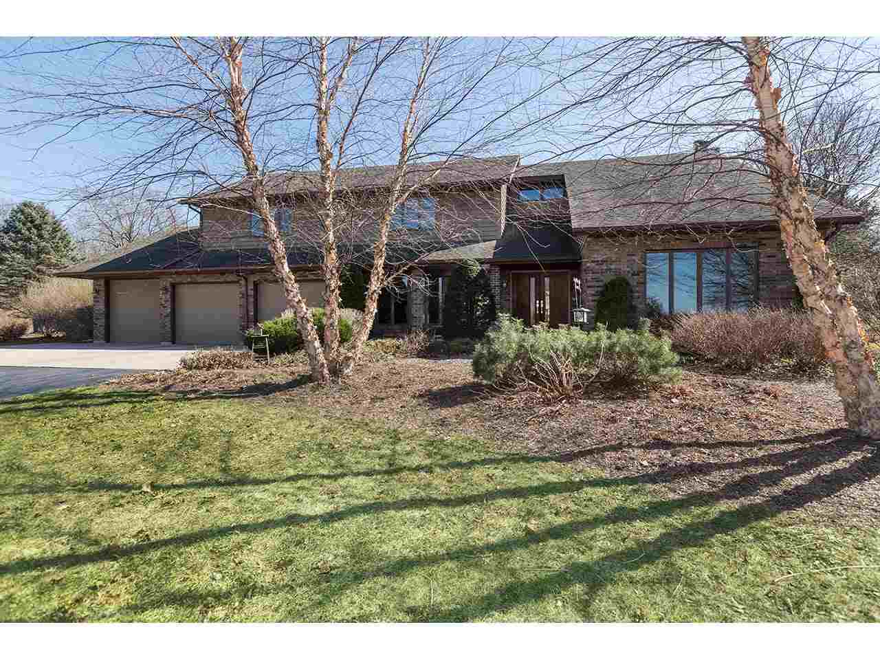4571 East Marrill Road Byron, IL 61010 - Photo 1 of 25 a front view of a house with garden
