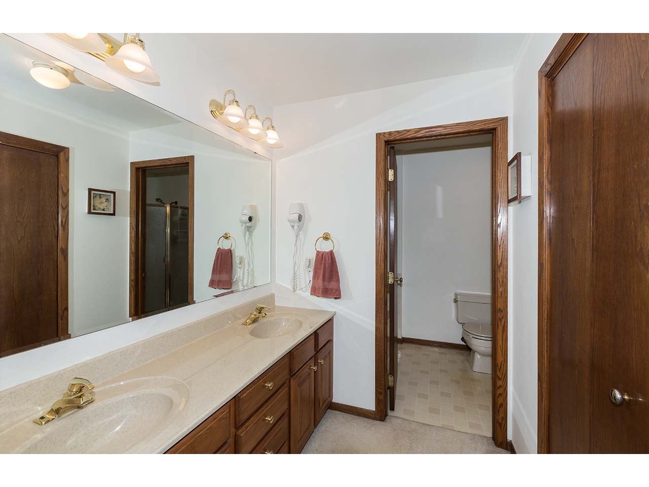 4571 East Marrill Road Byron, IL 61010 - Photo 11 of 25 a bathroom with a sink vanity and a mirror