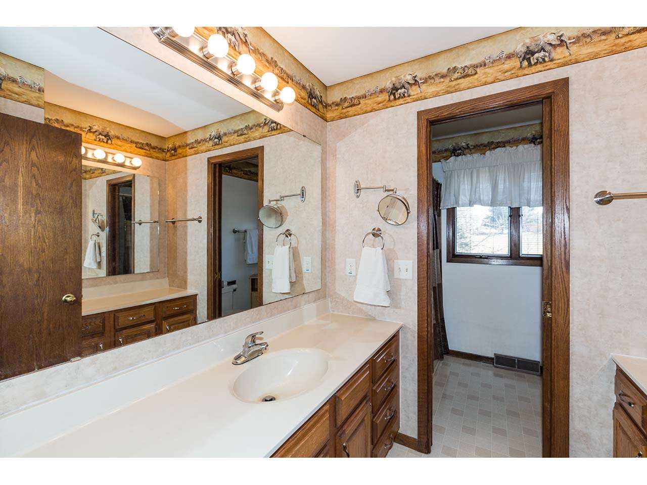 4571 East Marrill Road Byron, IL 61010 - Photo 15 of 25 a bathroom with a sink and a mirror