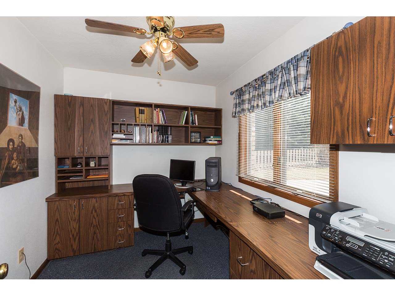4571 East Marrill Road Byron, IL 61010 - Photo 16 of 25 a view of a workspace with furniture and a window