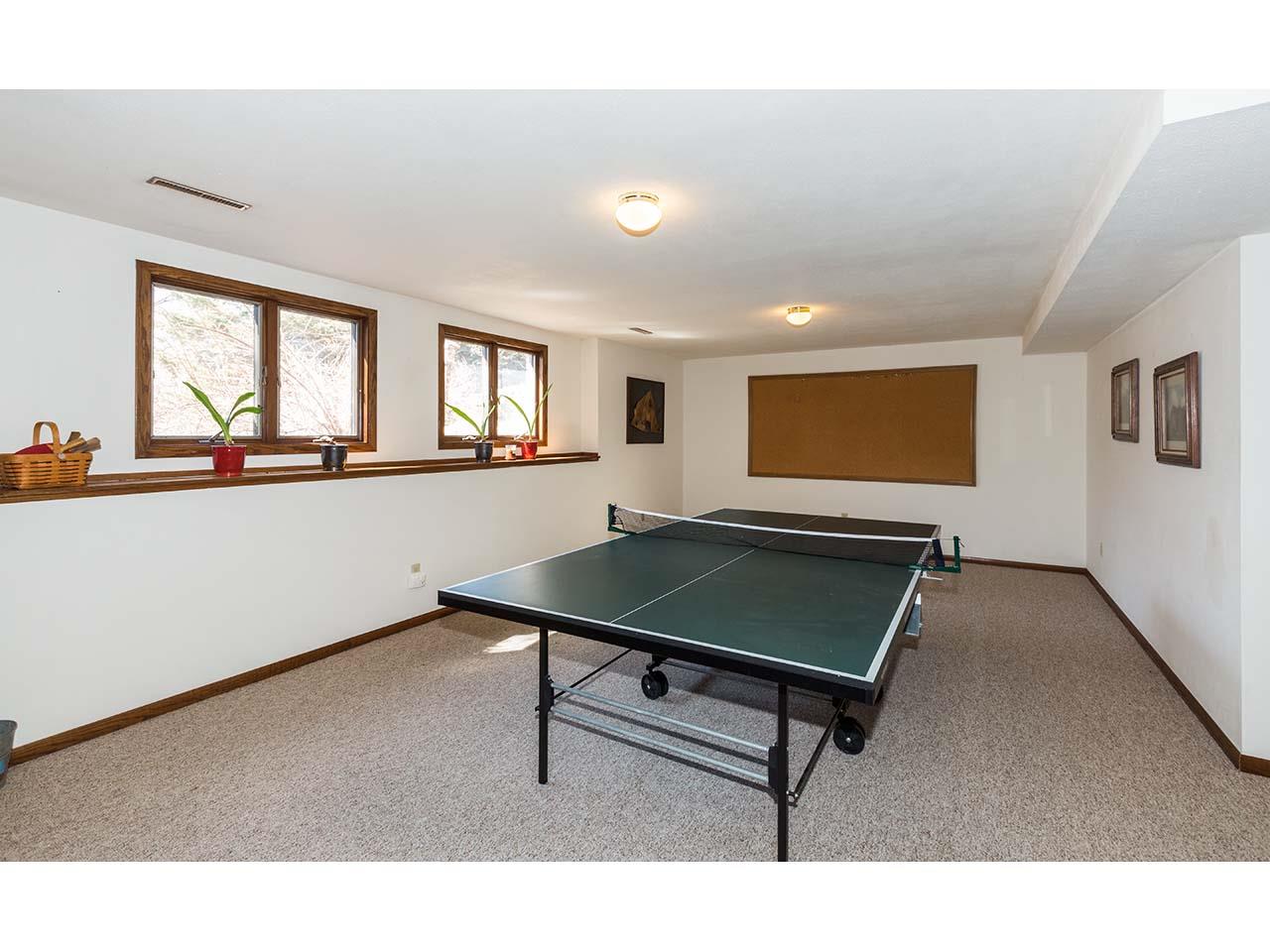 4571 East Marrill Road Byron, IL 61010 - Photo 19 of 25 a room with pool table and windows