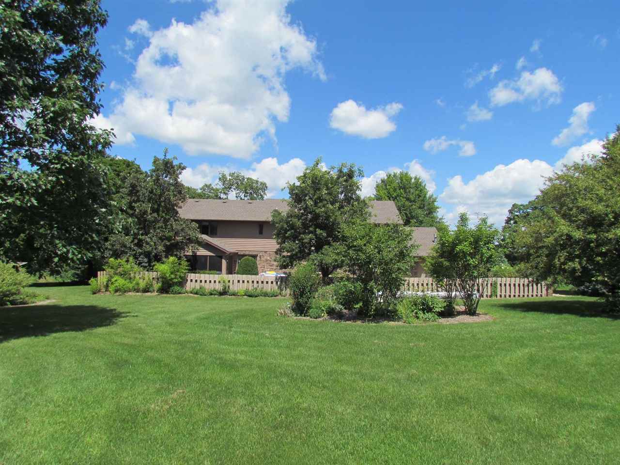 4571 East Marrill Road Byron, IL 61010 - Photo 25 of 25 a view of a house with a big yard