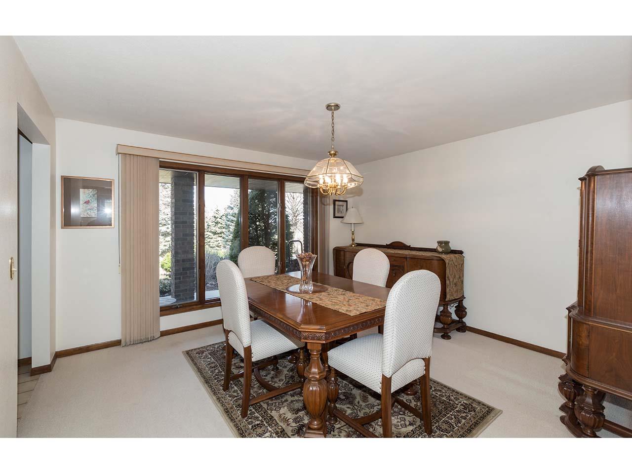 4571 East Marrill Road Byron, IL 61010 - Photo 4 of 25 a dining room with furniture a chandelier and window
