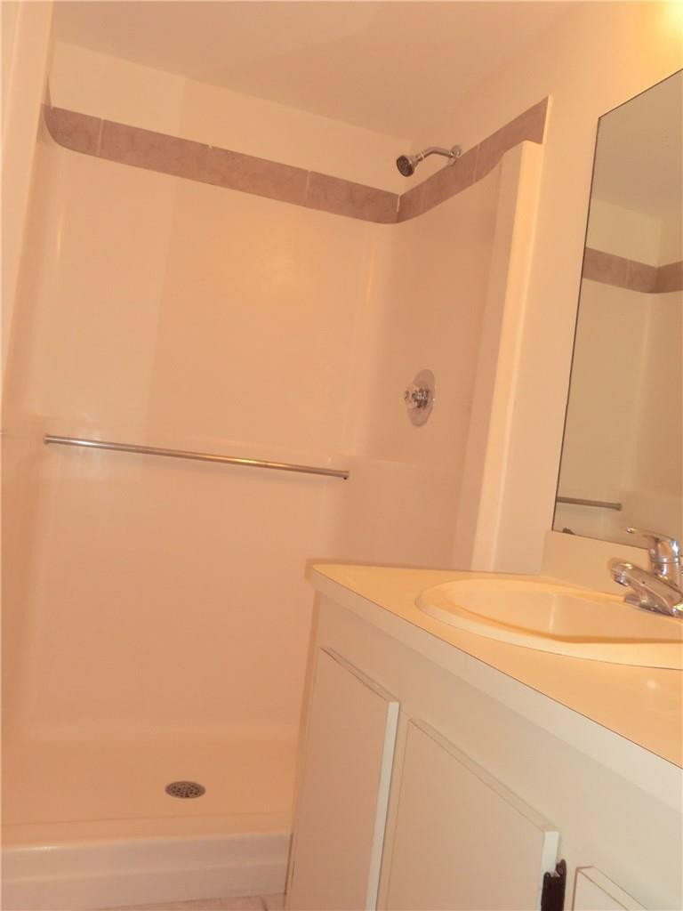 6796 Palmetto Circle South, Unit 101 Boca Raton, FL 33433 - Photo 15 of 29 a bathroom with a bathtub and a shower