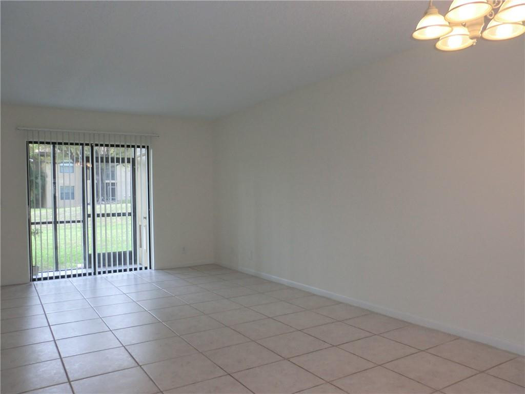 6796 Palmetto Circle South, Unit 101 Boca Raton, FL 33433 - Photo 2 of 29 a view of an empty room with a window