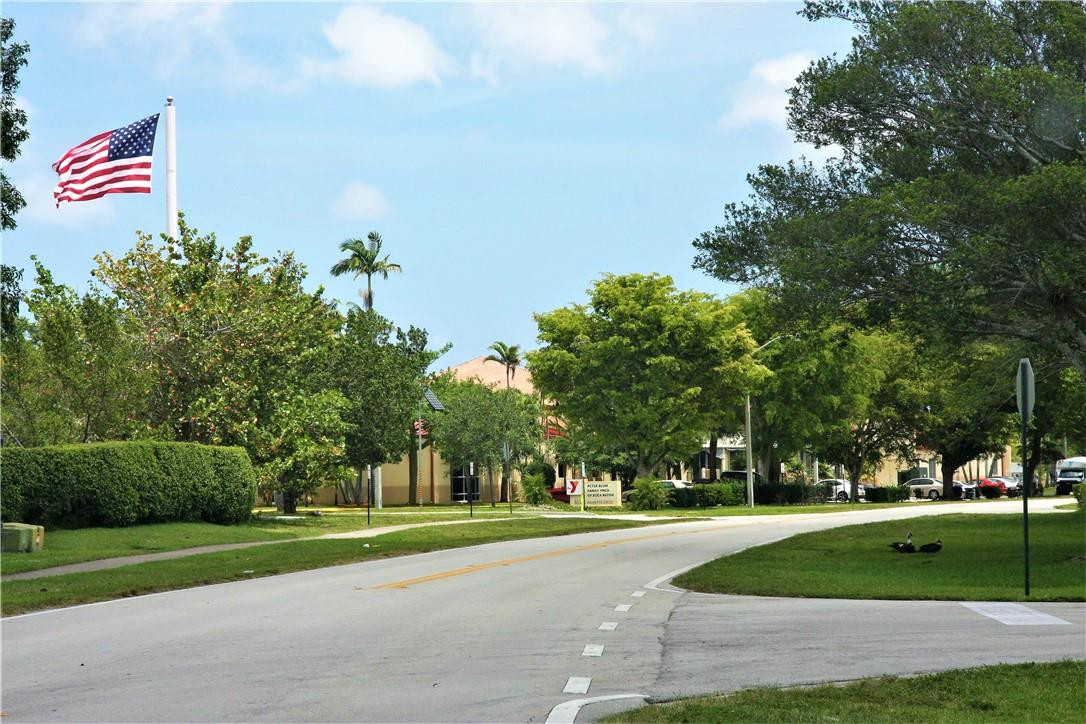 6796 Palmetto Circle South, Unit 101 Boca Raton, FL 33433 - Photo 28 of 29 a park view with large trees
