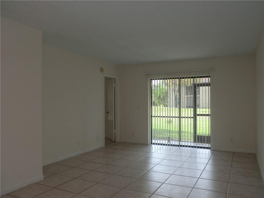 6796 Palmetto Circle South, Unit 101 Boca Raton, FL 33433 - Photo 3 of 29 a view of an empty room with a window