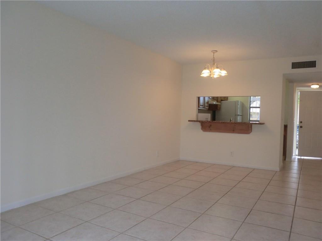 6796 Palmetto Circle South, Unit 101 Boca Raton, FL 33433 - Photo 5 of 29 a view of a livingroom with furniture