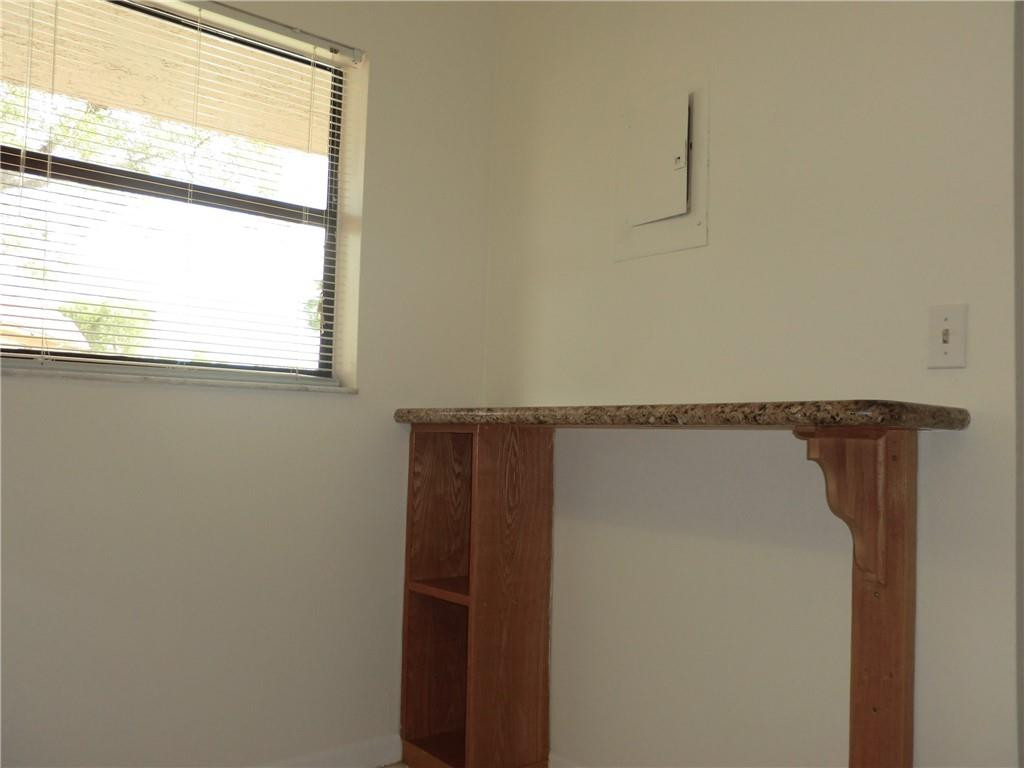 6796 Palmetto Circle South, Unit 101 Boca Raton, FL 33433 - Photo 10 of 29 a close view of cabinet and tap