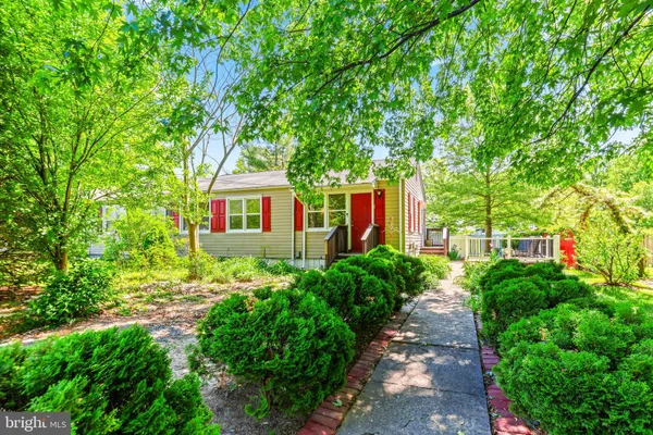 a view of a house with a small yard