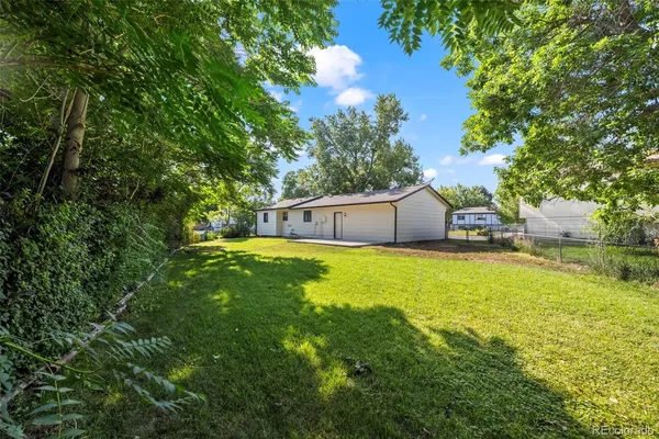 a house view with swimming pool in front of it