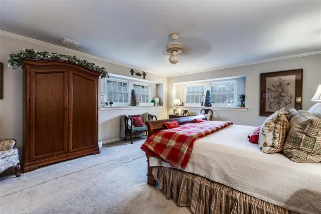 a bedroom with bed and a window