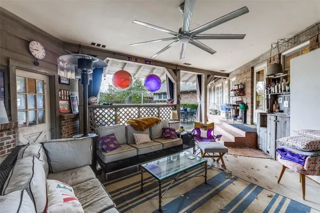 a living room with lots of furniture and a rug