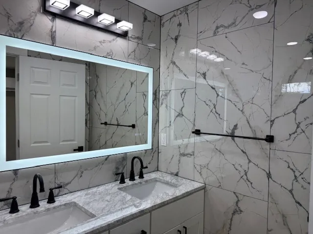 a bathroom with a sink and a mirror