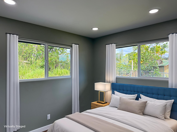 144 Chong Street Hilo, HI 96720 - Photo 14 of 28 a bedroom with a bed and a large window